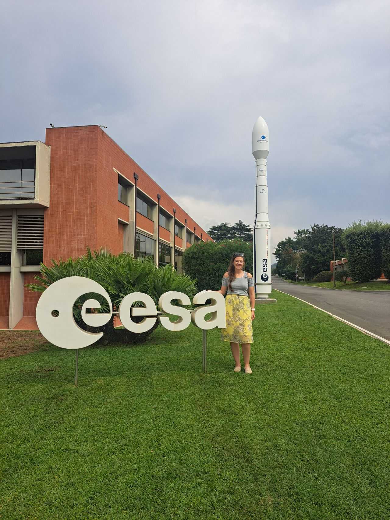 A photo of me in front of a model rocket at ESA-ESRIN.