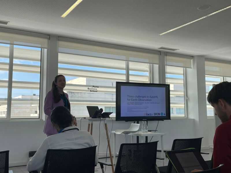 A photo of me presenting at COSEAL 2025.