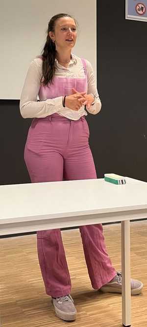 A photo of Julia giving a talk.