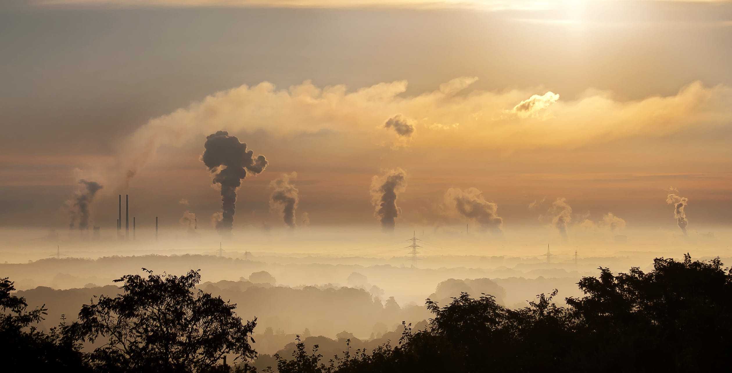 Image of factory emissions in background