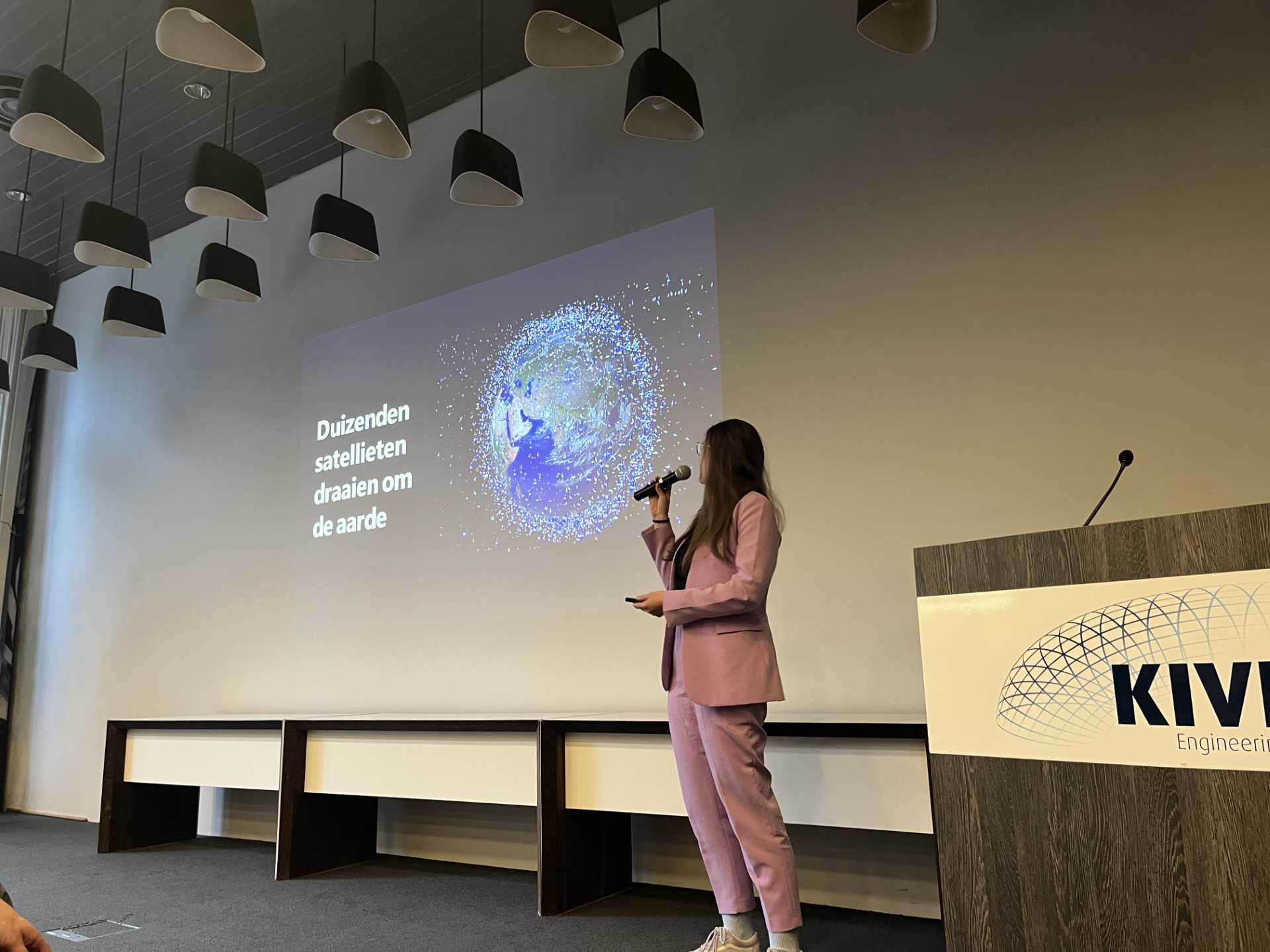 A photo of me presenting at the event.