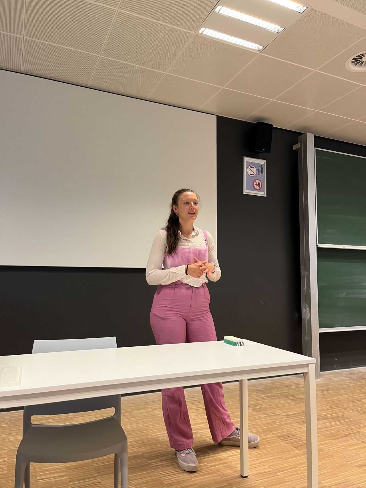 A photo of me, dressed almost all in pink, hosting my ML4EO workshop.